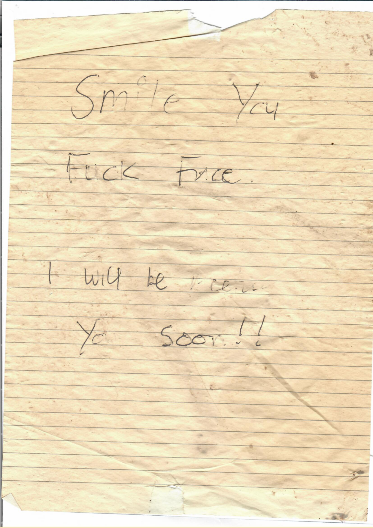 Handwritten note found stuck to a bird scarer near the North Norfolk camping and glamping site: Smile You Fuck Face. I will be seeing You Soon!!